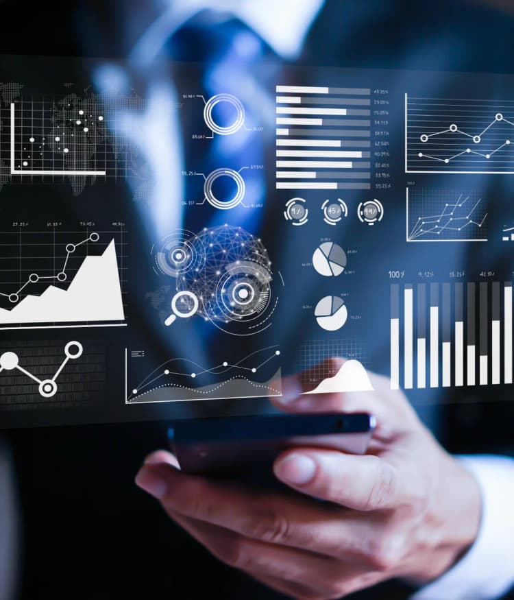 Graphs and charts overlayed over man holding a phone