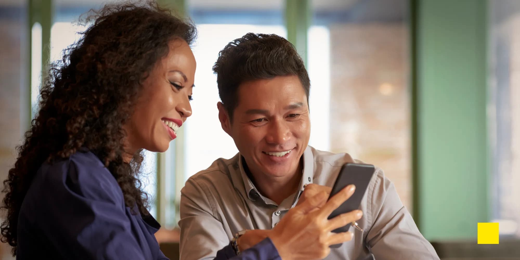 A digital business card saved as a pass in Apple Wallet and Google Wallet on two smartphones